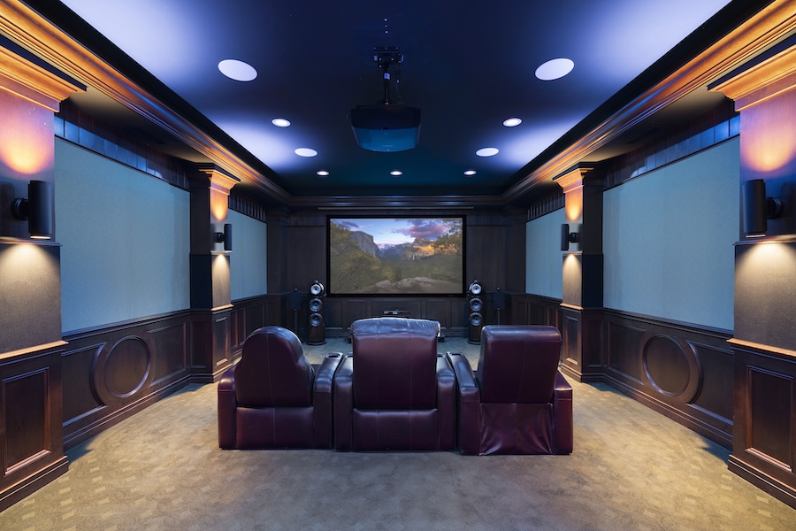 In Focus Systems’ showroom theater space with plush leather seating and immersive visual display